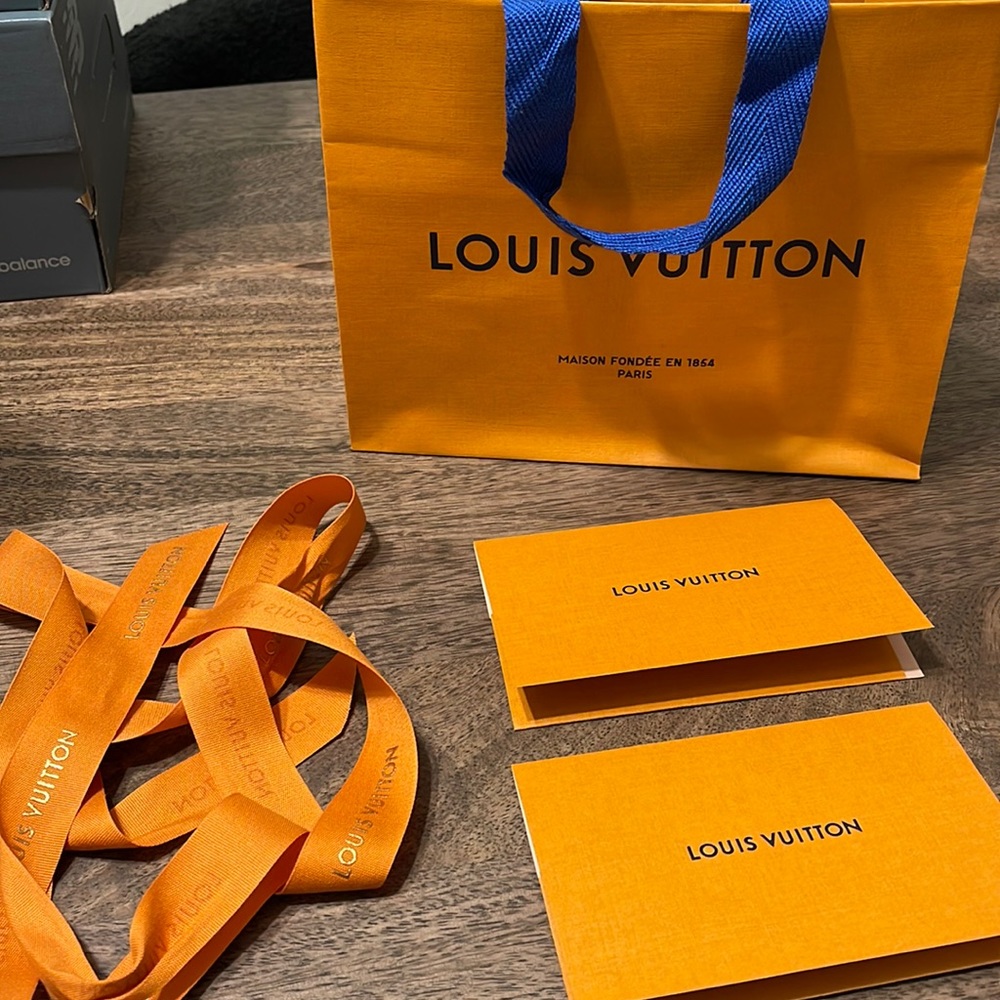 Louis Vuitton shopping bag, envelopes and ribbon